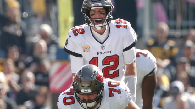 Buccaneers quarterback Tom Brady (12) calls out a play at the line of scrimmage as center Robert Hainsey (70) prepares to snap the ball against the Steelers.